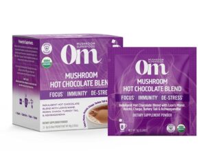 Image of full box of Om Mushroom Superfood Organic Hot Chocolate containing 10 packets each with 8g servings delivering super 'shroomies Lion's Mane, Reishi, Chaga, and Turkey Tail plus adaptogenic herb Ashwagandha to balance the nervous system, boost immunity, lower inflammation, improve mental clarity and focus, and enhance overall health.